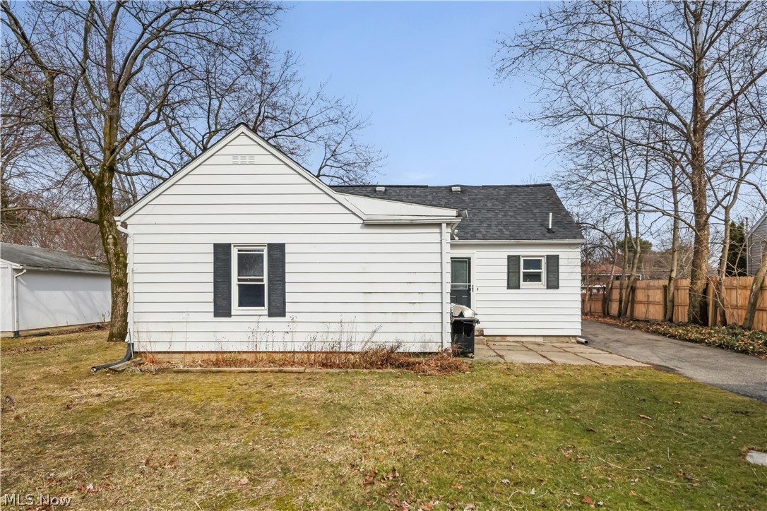 4544 Fishcreek Road Stow, OH 44224 - Photo 34 of 40 Rear view of house with a shingled roof and a patio area