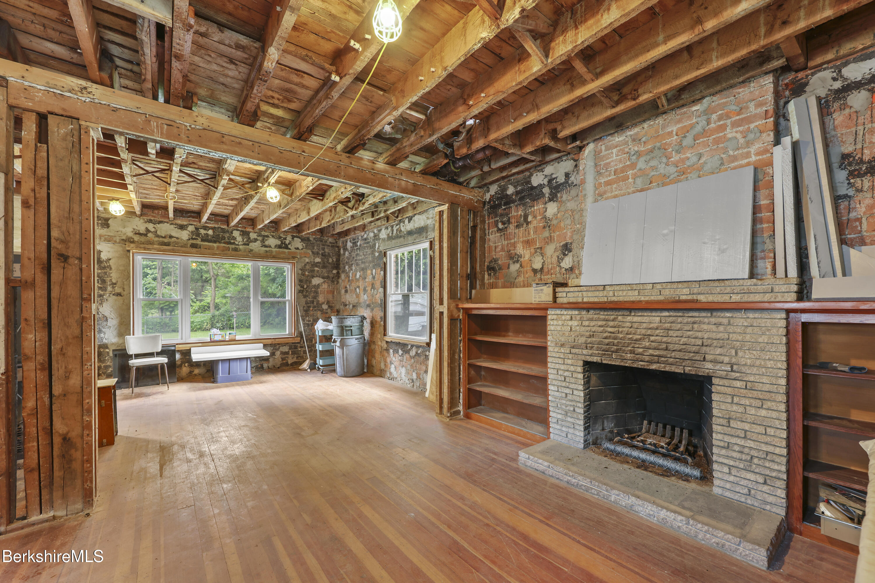 84 Notch Road North Adams, MA 01247 - Photo 6 of 30 a view of a room with furniture large windows and a fireplace