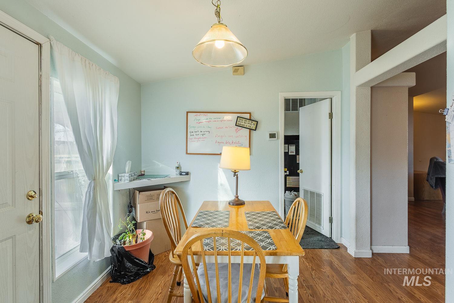 4119 Ashton Avenue Caldwell, ID 83607 - Photo 21 of 50 Dining room with wood finished floors and lofted ceiling