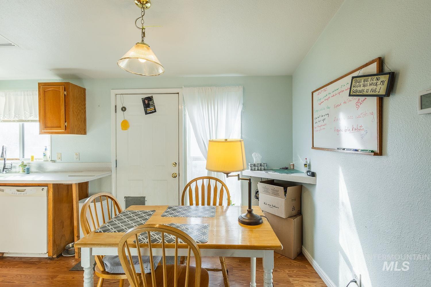 4119 Ashton Avenue Caldwell, ID 83607 - Photo 22 of 50 Dining space featuring light wood finished floors and a textured wall