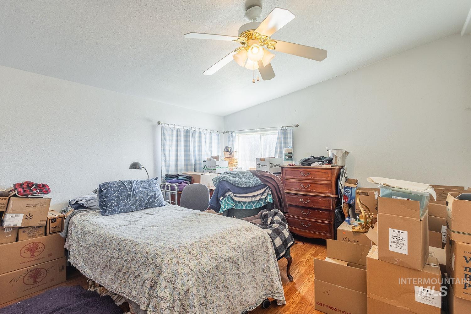 4119 Ashton Avenue Caldwell, ID 83607 - Photo 24 of 50 Bedroom featuring lofted ceiling, light wood finished floors, and ceiling fan
