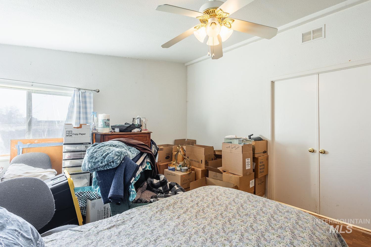 4119 Ashton Avenue Caldwell, ID 83607 - Photo 25 of 50 Bedroom with a closet and ceiling fan