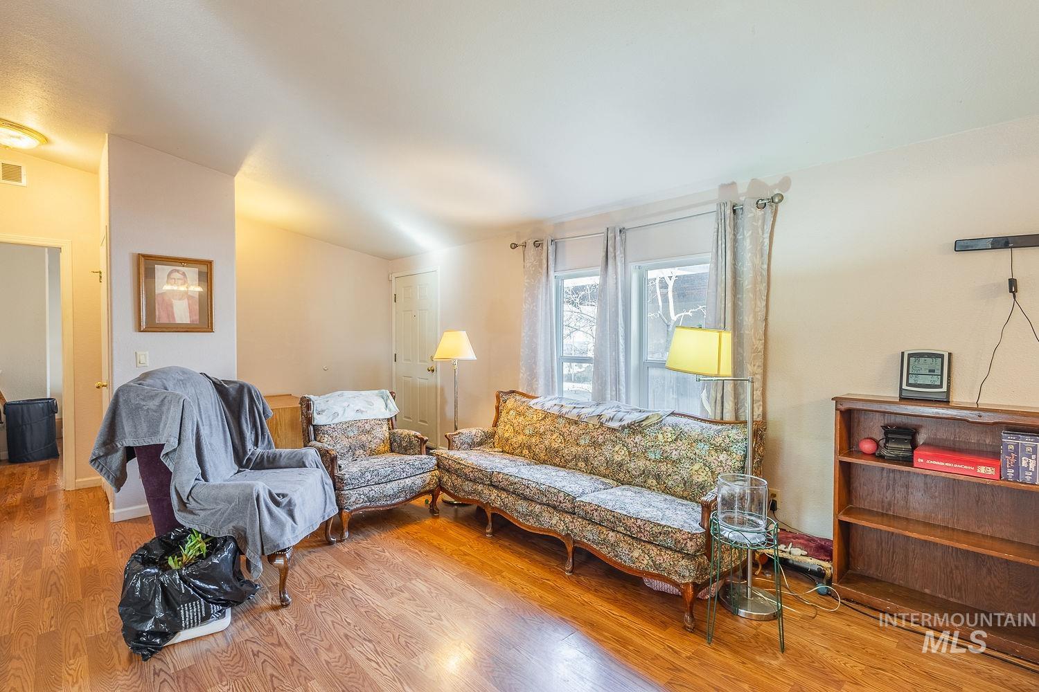 4119 Ashton Avenue Caldwell, ID 83607 - Photo 9 of 50 Living room with wood finished floors and lofted ceiling