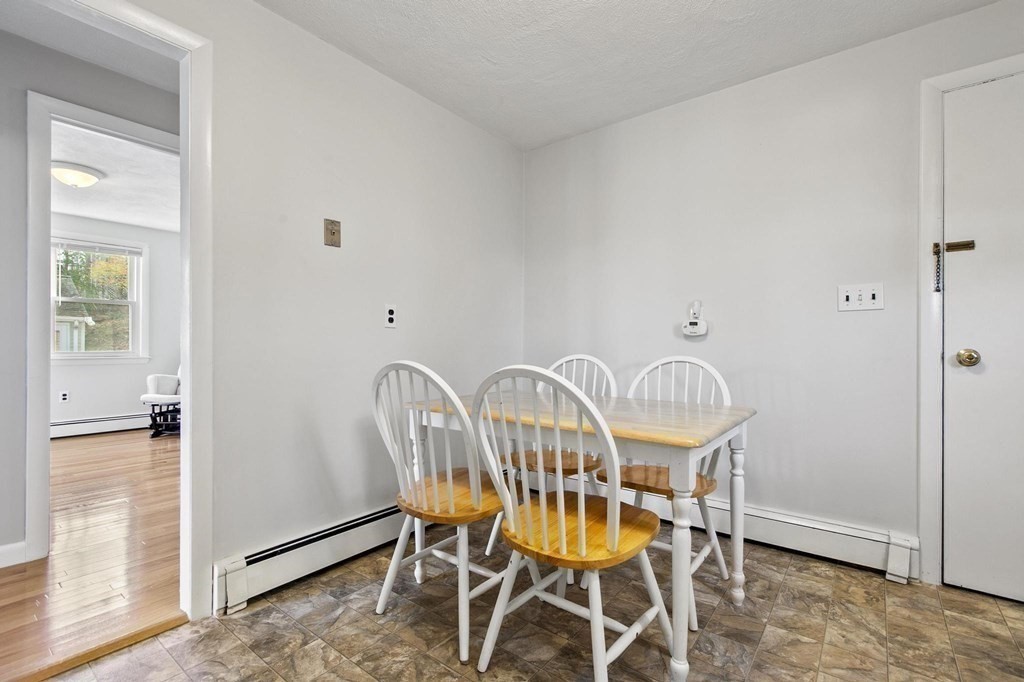 6 Dundee Road, Unit 6 Arlington, MA 02476 - Photo 15 of 29 a view of a dining room with furniture window and wooden floor