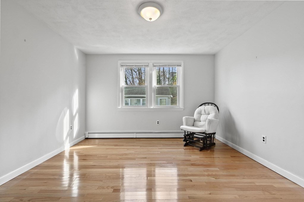 6 Dundee Road, Unit 6 Arlington, MA 02476 - Photo 16 of 29 a room with furniture and a window