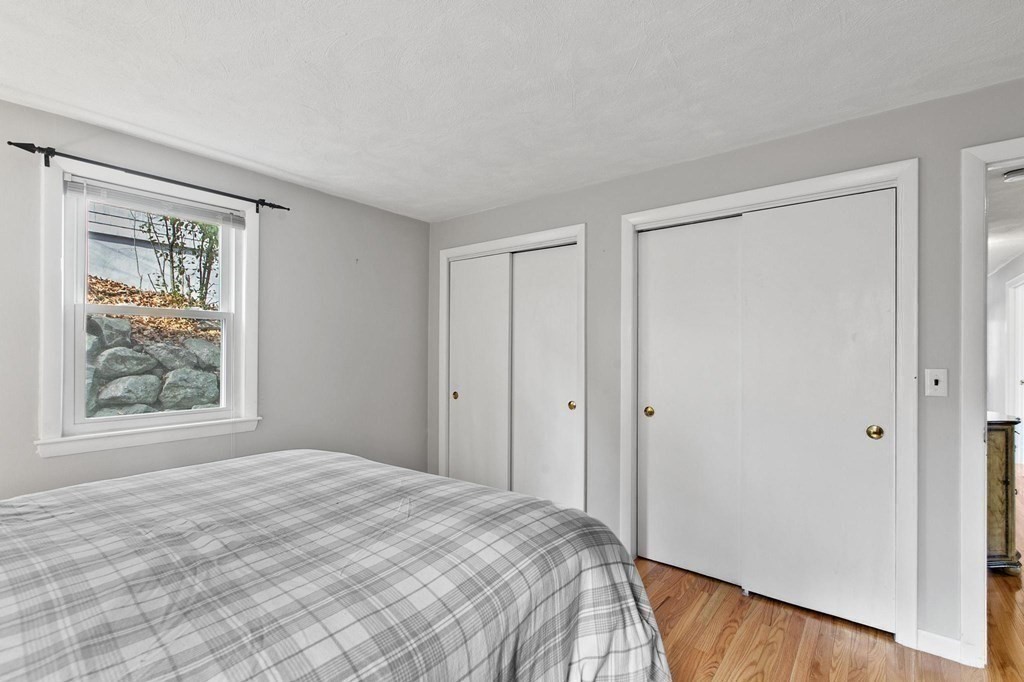 6 Dundee Road, Unit 6 Arlington, MA 02476 - Photo 21 of 29 a bedroom with a bed and a window