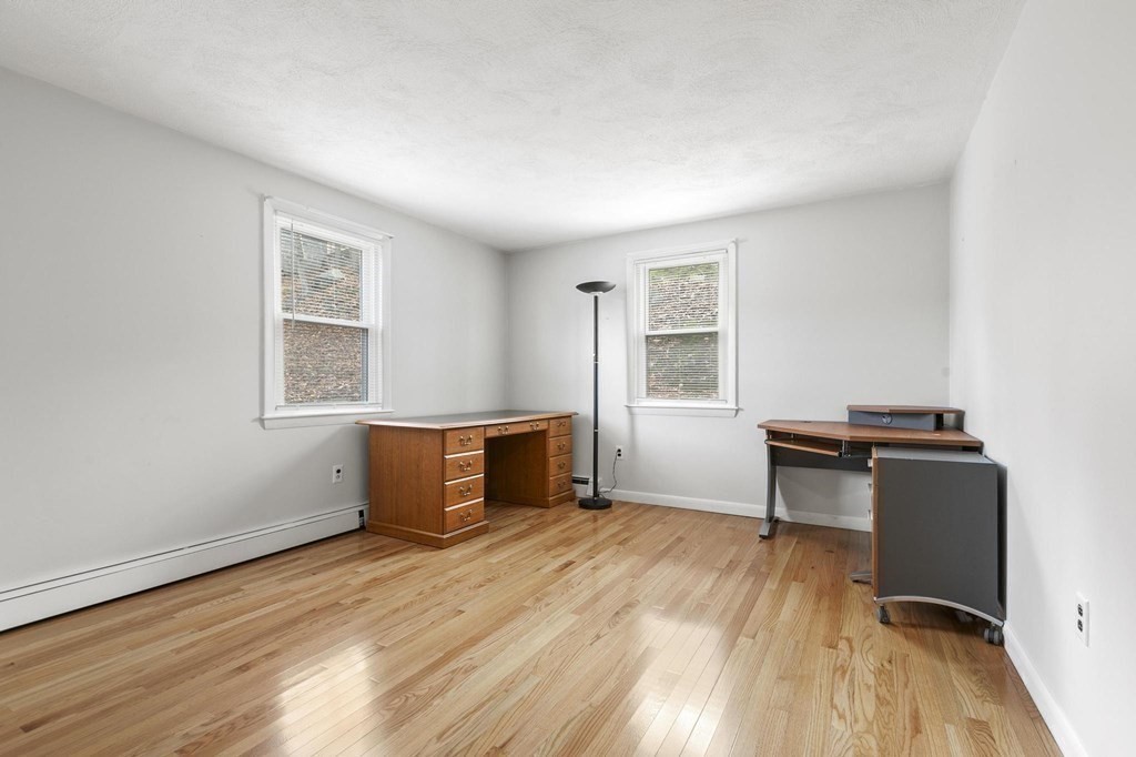 6 Dundee Road, Unit 6 Arlington, MA 02476 - Photo 22 of 29 a workspace with furniture window and wooden floor