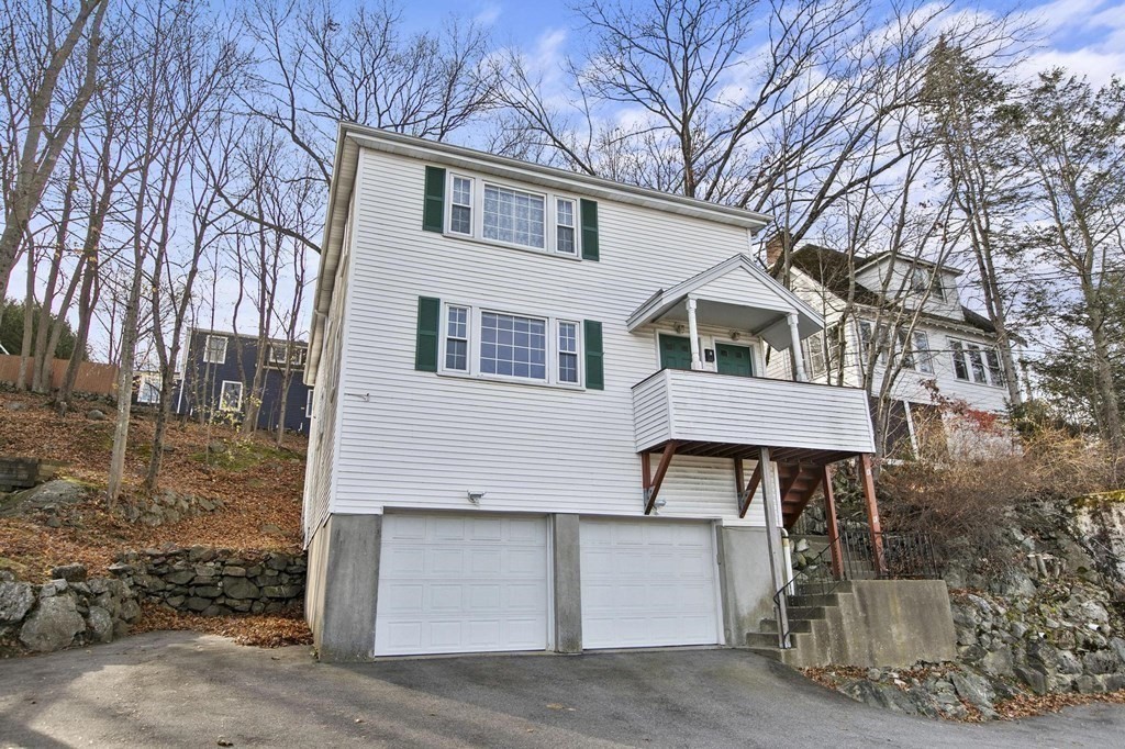 6 Dundee Road, Unit 6 Arlington, MA 02476 - Photo 3 of 29 a view of a white house with a large tree