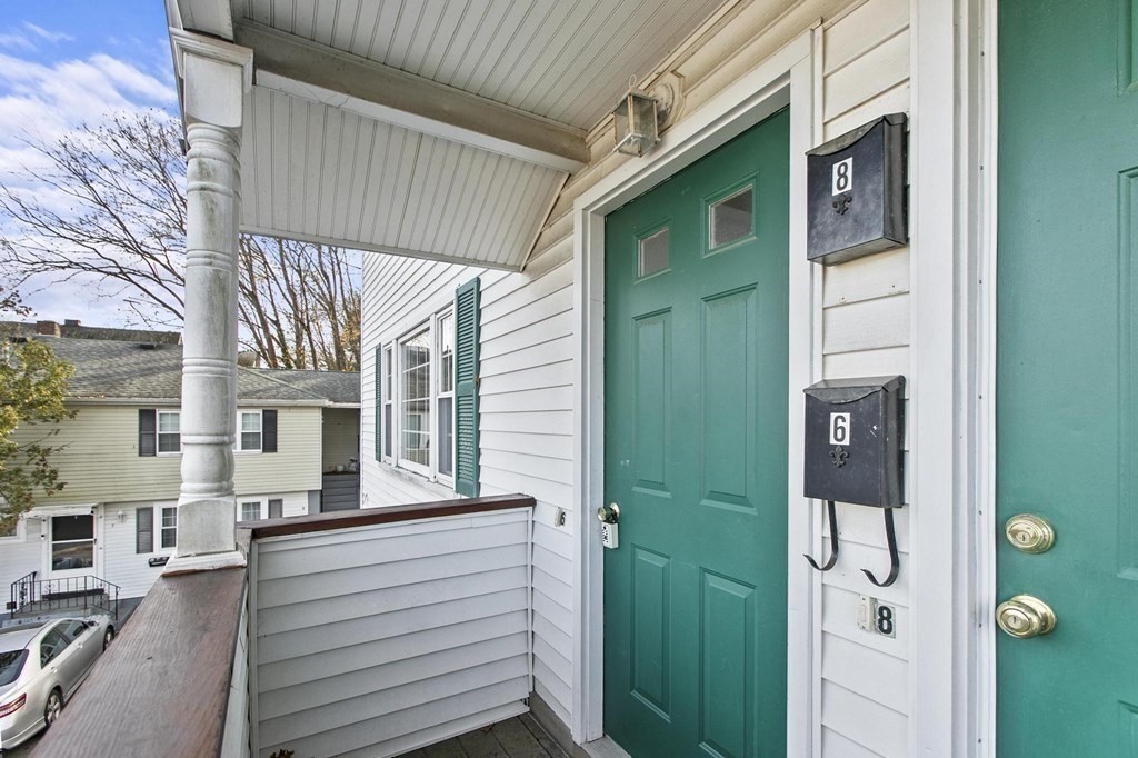 6 Dundee Road, Unit 6 Arlington, MA 02476 - Photo 5 of 29 a view of front door of house
