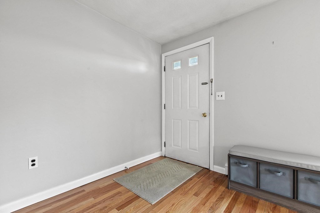 6 Dundee Road, Unit 6 Arlington, MA 02476 - Photo 6 of 29 a view of a room with wooden floor