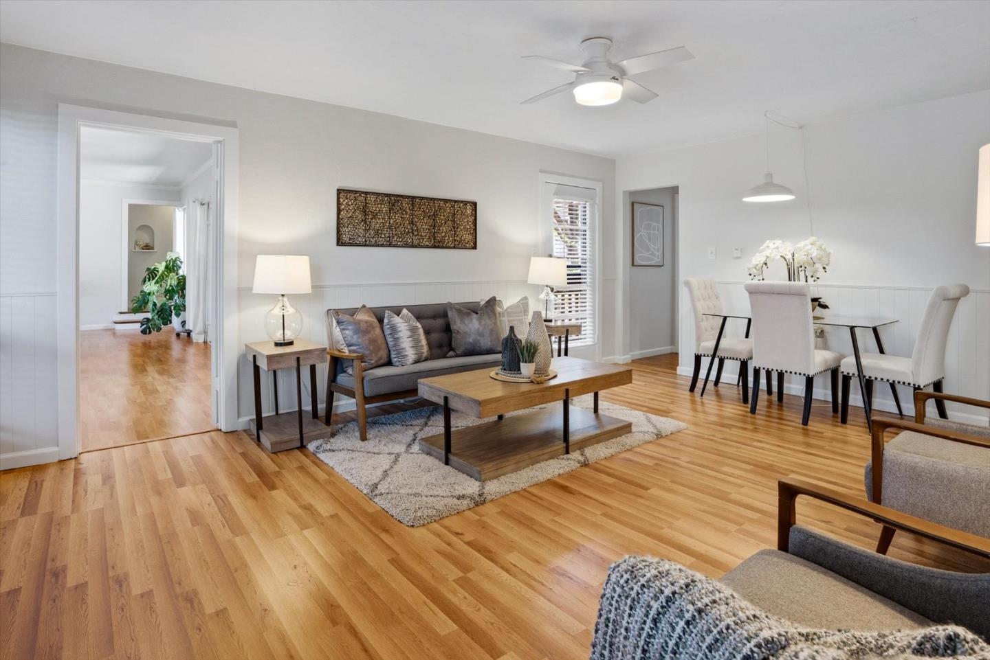 16899 Kennedy Road Los Gatos, CA 95032 - Photo 10 of 61 a living room with furniture a wooden floor and next to a window