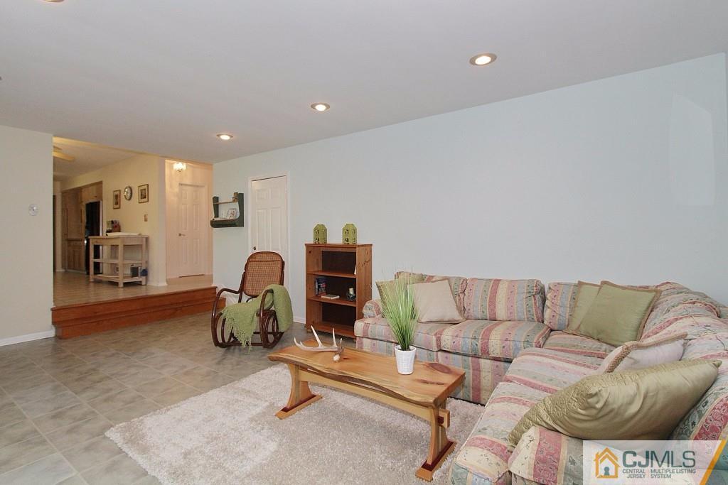 62 Harding Avenue Edison, NJ 08820 - Photo 12 of 24 a living room with furniture a couch and a potted plant