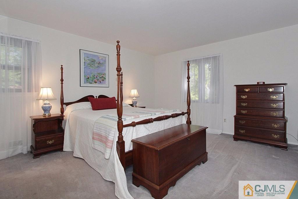 62 Harding Avenue Edison, NJ 08820 - Photo 14 of 24 a bed room with a bed and a television