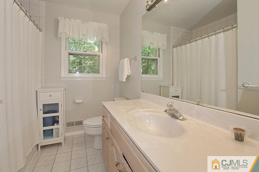 62 Harding Avenue Edison, NJ 08820 - Photo 19 of 24 a bathroom with a sink toilet and tub