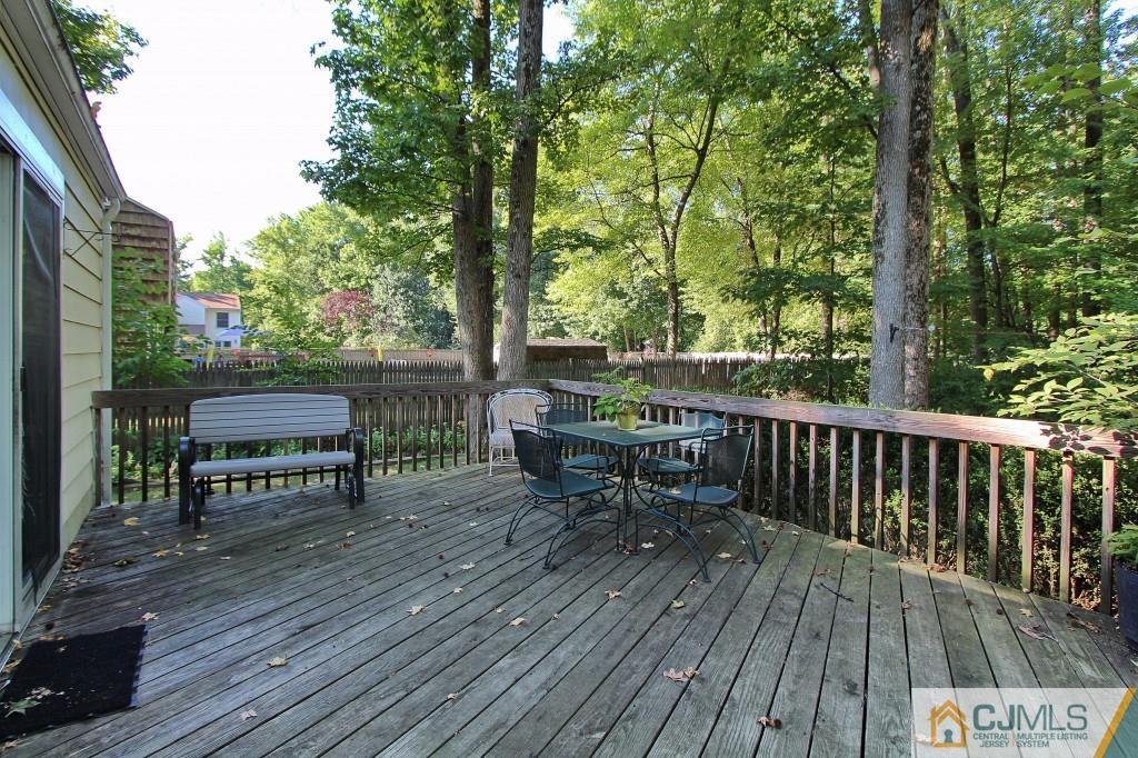 62 Harding Avenue Edison, NJ 08820 - Photo 20 of 24 a view of a deck with furniture and trees