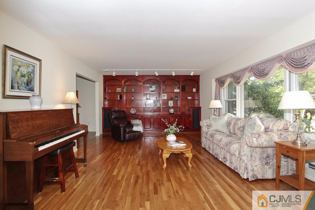 62 Harding Avenue Edison, NJ 08820 - Photo 5 of 24 a living room with furniture and wooden floor