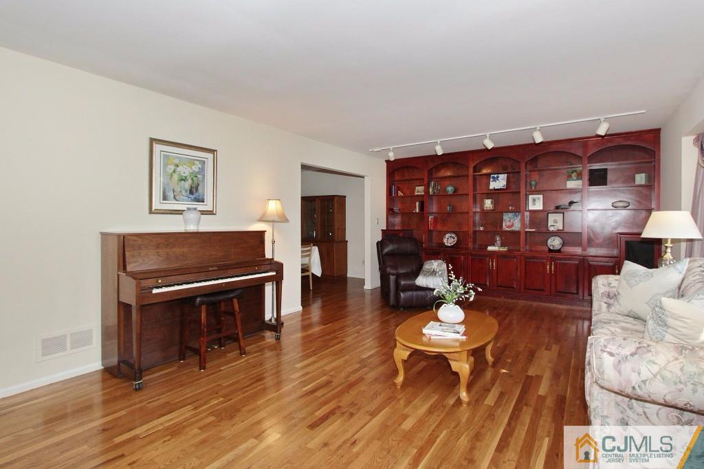62 Harding Avenue Edison, NJ 08820 - Photo 6 of 24 a living room with furniture and wooden floor