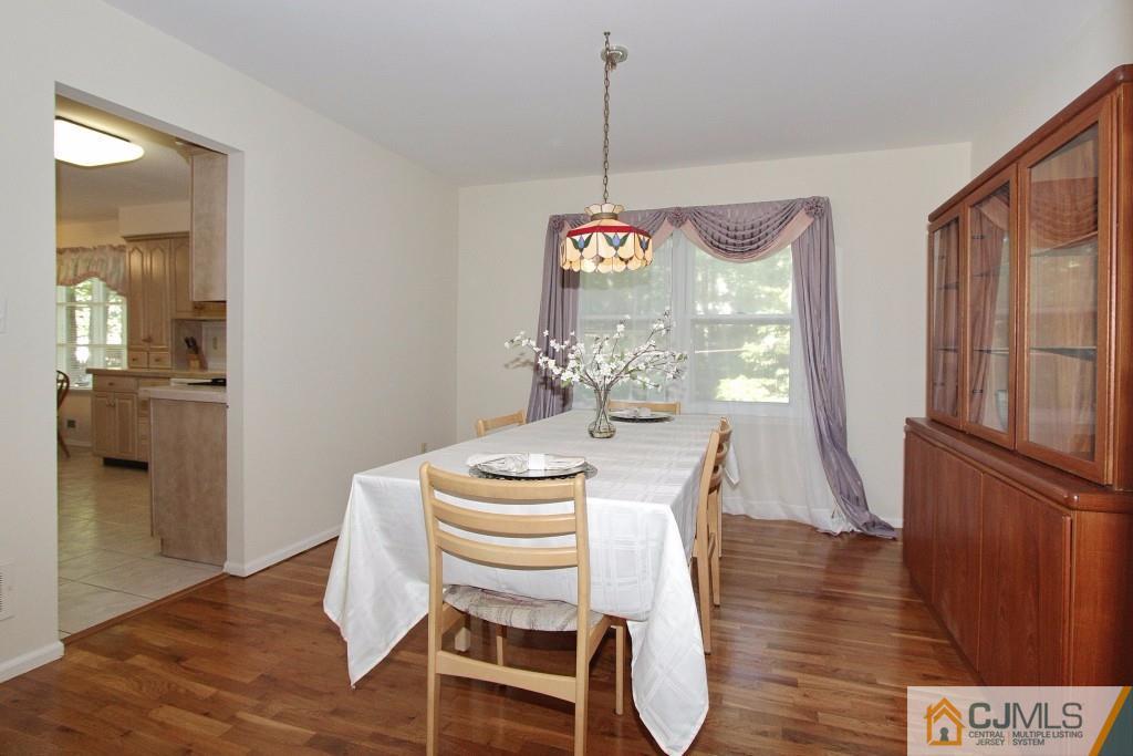 62 Harding Avenue Edison, NJ 08820 - Photo 7 of 24 a view of a dining room with furniture window and wooden floor