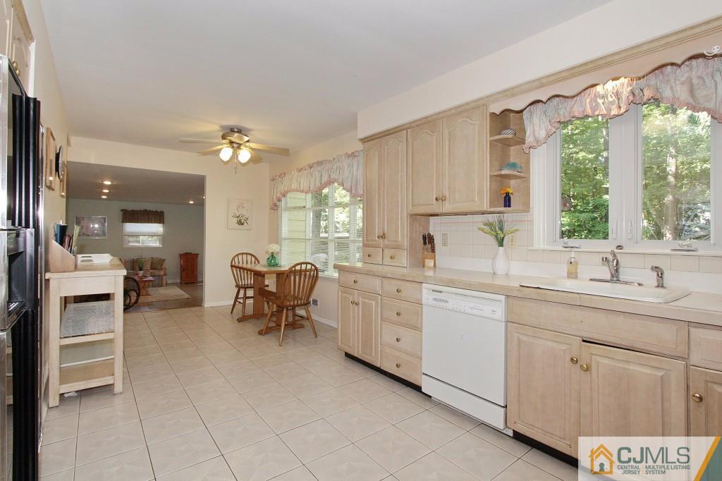 62 Harding Avenue Edison, NJ 08820 - Photo 8 of 24 a kitchen with sink cabinets and window