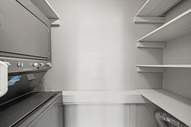 a kitchen with stainless steel appliances a sink a stove and cabinets