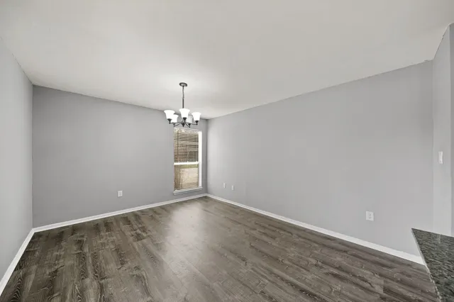 a bathroom with a toilet a sink and a mirror