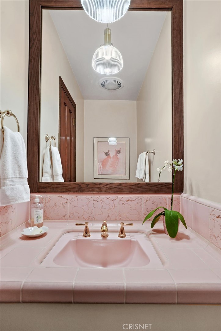 3620 Wrightwood Drive Studio City, CA 91604 - Photo 19 of 39 a bathroom with a double vanity sink and a mirror