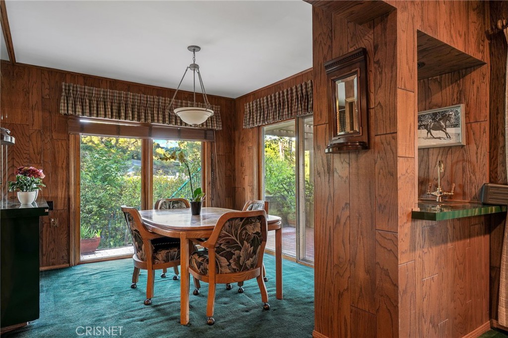 3620 Wrightwood Drive Studio City, CA 91604 - Photo 20 of 39 a dining room with furniture large windows and a chandelier