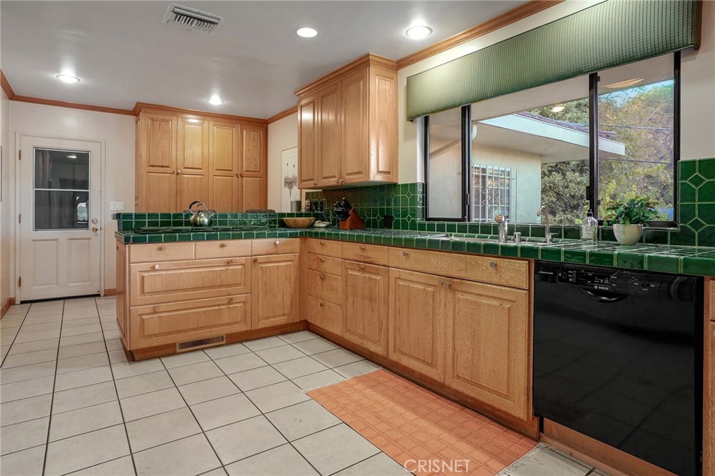 3620 Wrightwood Drive Studio City, CA 91604 - Photo 23 of 39 a kitchen with a sink and cabinets