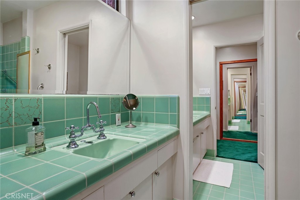 3620 Wrightwood Drive Studio City, CA 91604 - Photo 28 of 39 a bathroom with a sink and mirror