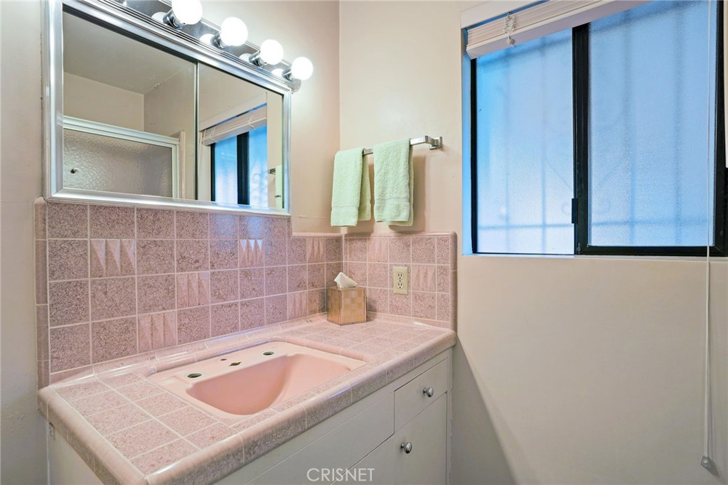 3620 Wrightwood Drive Studio City, CA 91604 - Photo 32 of 39 a bathroom with a sink and a mirror