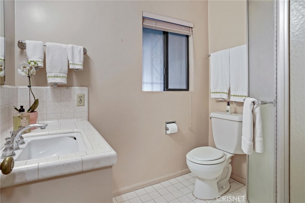 3620 Wrightwood Drive Studio City, CA 91604 - Photo 35 of 39 a white toilet sitting next to a bathroom sink