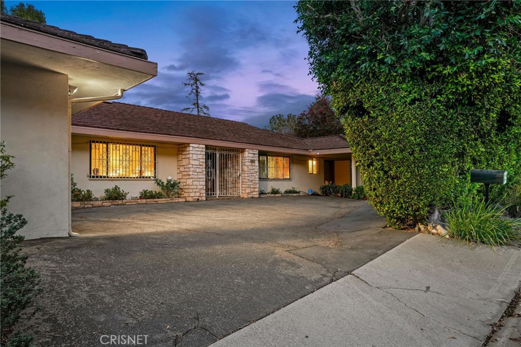 3620 Wrightwood Drive Studio City, CA 91604 - Photo 9 of 39 a front view of a house with a yard and garage