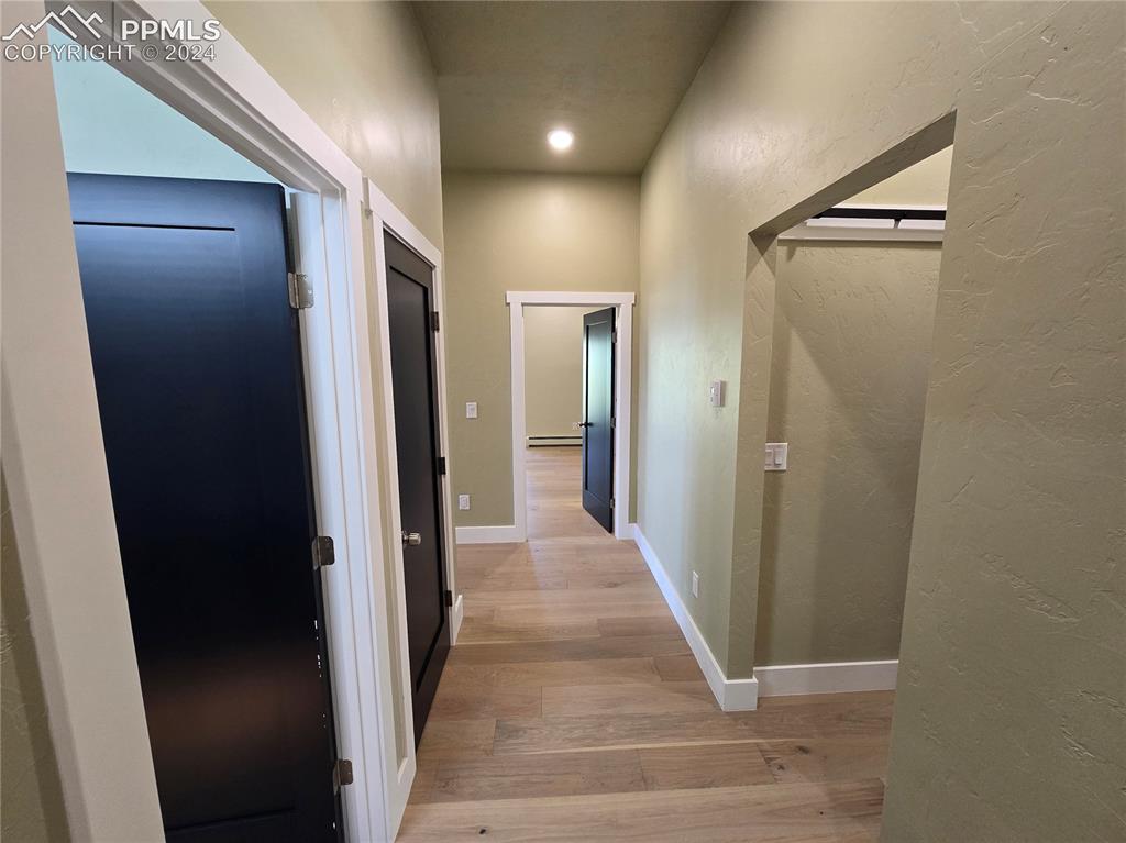 33036 Meadow Ridge Lane Trinidad, CO 81082 - Photo 32 of 50 Corridor with light hardwood / wood-style flooring and a baseboard radiator
