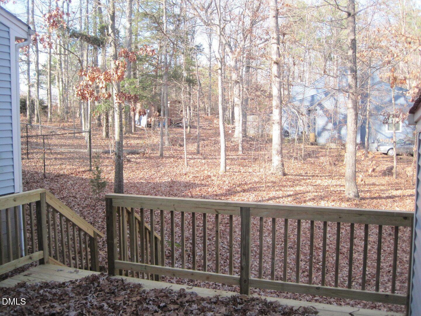 4705 Fargo Court, Unit B Raleigh, NC 27612 - Photo 6 of 6 a view of a wooden fence