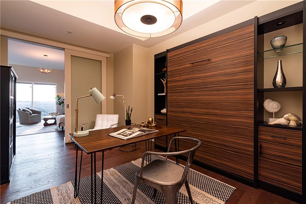 1820 Peachtree Road Northwest, Unit 1408 Atlanta, GA 30309 - Photo 18 of 37 a room with furniture and wooden floor