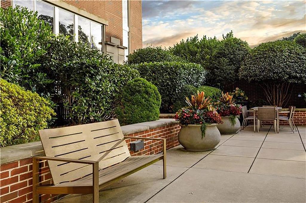 1820 Peachtree Road Northwest, Unit 1408 Atlanta, GA 30309 - Photo 34 of 37 a view of a patio with couches and potted plants
