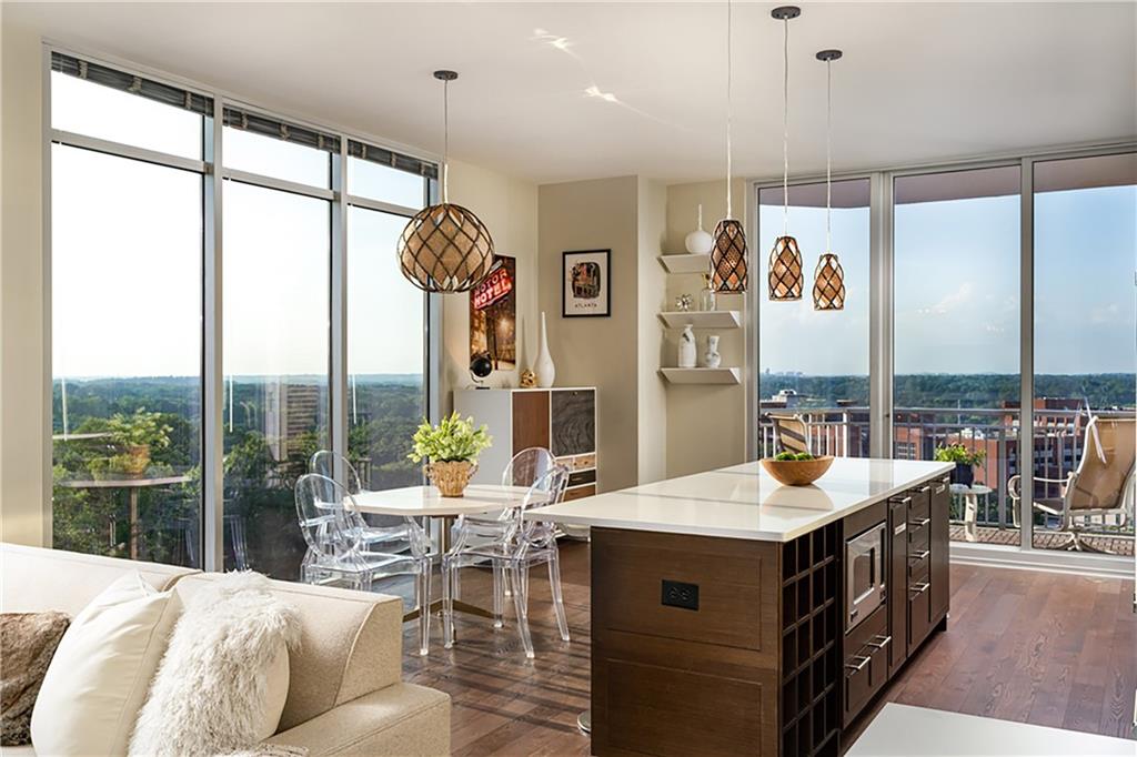 1820 Peachtree Road Northwest, Unit 1408 Atlanta, GA 30309 - Photo 6 of 37 a living room with large windows