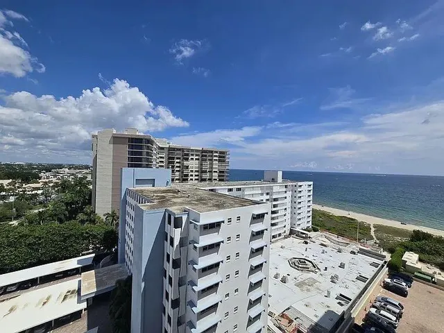a view of a balcony with an ocean