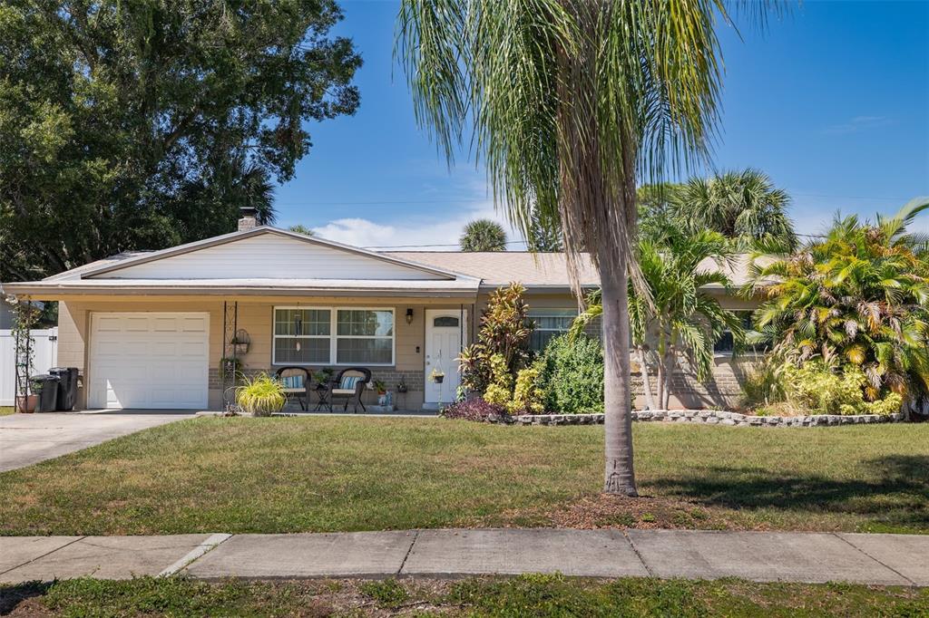 7656 85th Lane Seminole, FL 33777 - Photo 1 of 46 front view of a house with a yard