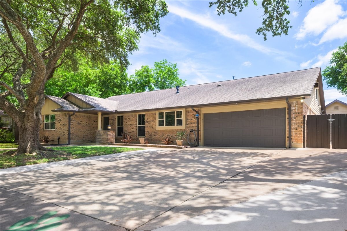 1502 Reimer Street Brenham, TX 77833 - Photo 6 of 30 a front view of a house with yard and trees