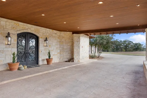 a view of a building with porch and outdoor seating