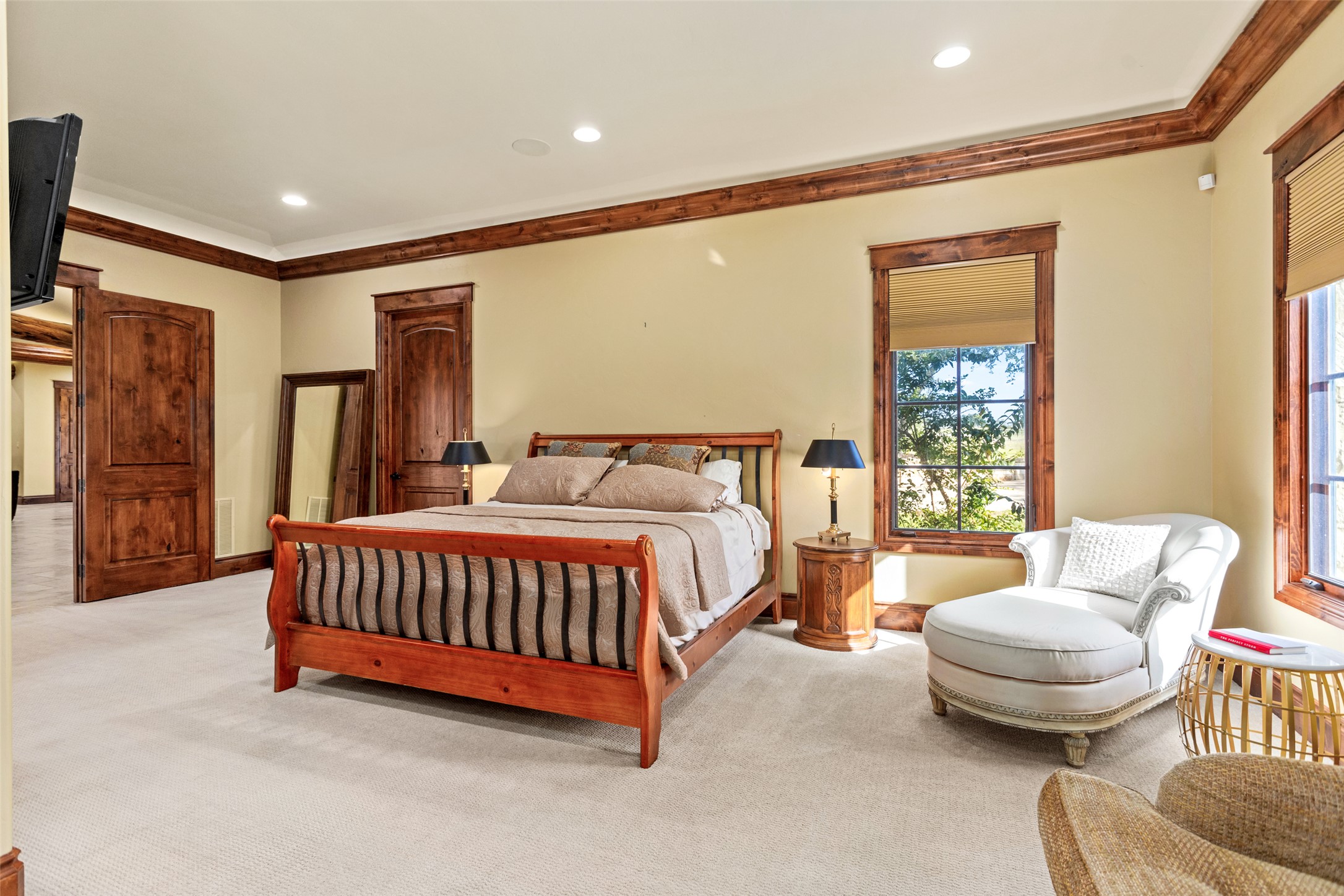 170 Goose Landing, Unit 10 57ACRES Harper, TX 78631 - Photo 24 of 40 a spacious bedroom with a bed and glass window