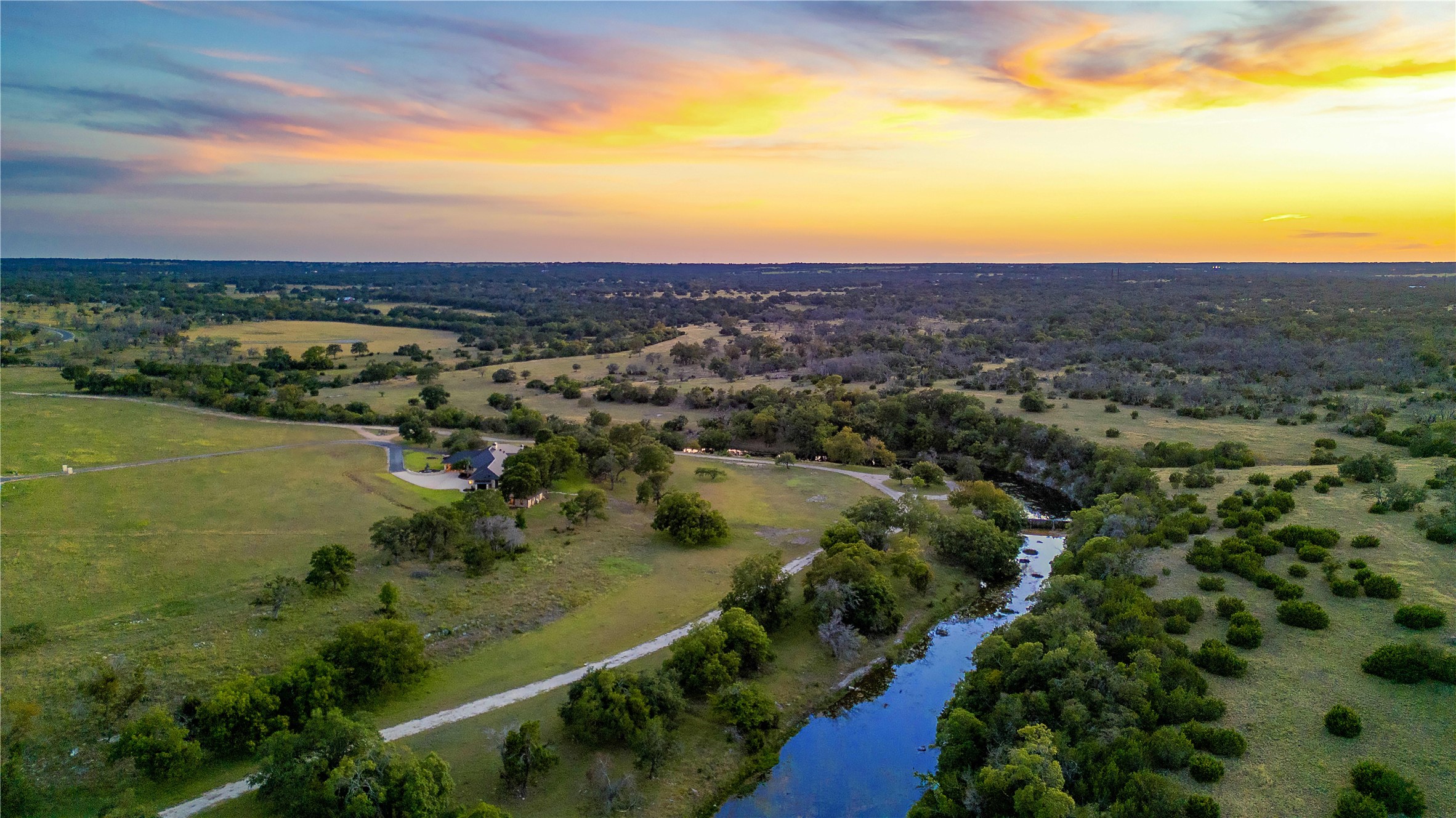 170 Goose Landing, Unit 10 57ACRES Harper, TX 78631 - Photo 3 of 40 a view of a city with ocean view