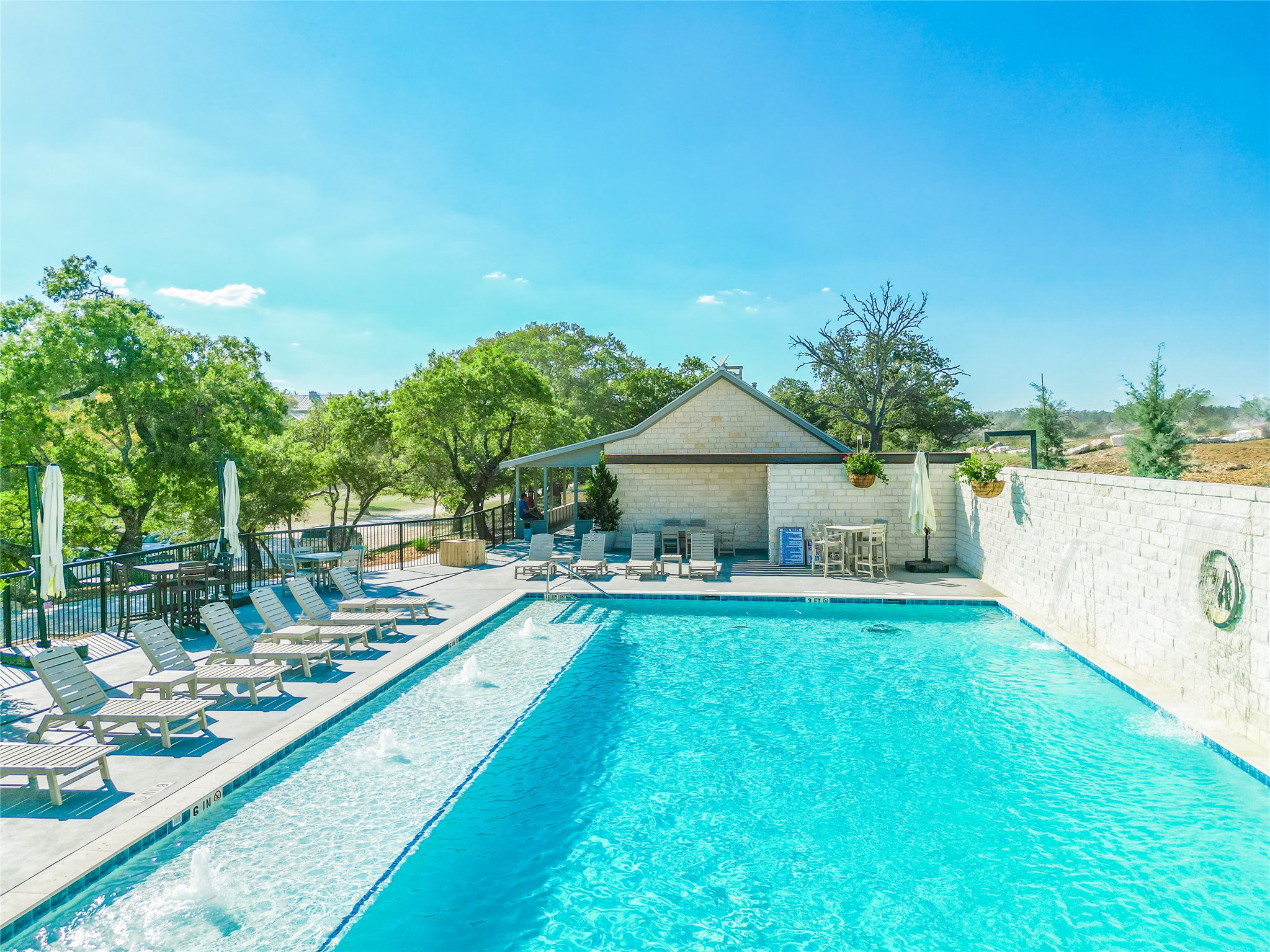 170 Goose Landing, Unit 10 57ACRES Harper, TX 78631 - Photo 34 of 40 a view of a house with swimming pool and sitting area