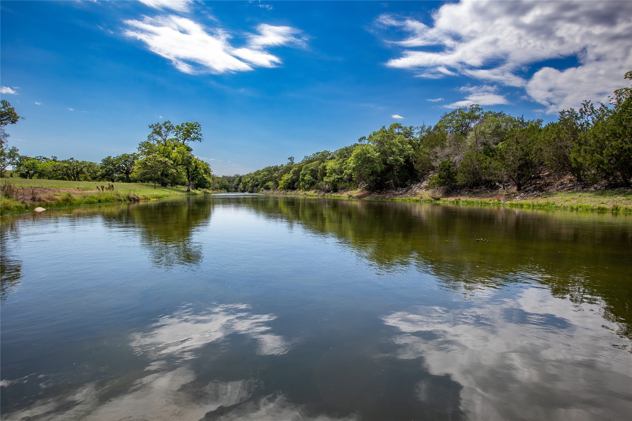 170 Goose Landing, Unit 10 57ACRES Harper, TX 78631 - Photo 5 of 40 a view of a lake with houses in the back