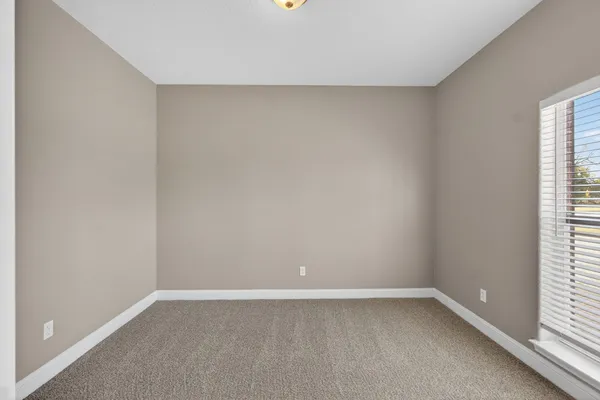 a kitchen with stainless steel appliances a stove a microwave and a hard wood floors