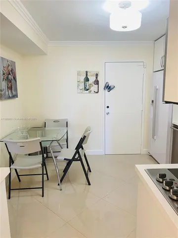a view of a livingroom with furniture and a window
