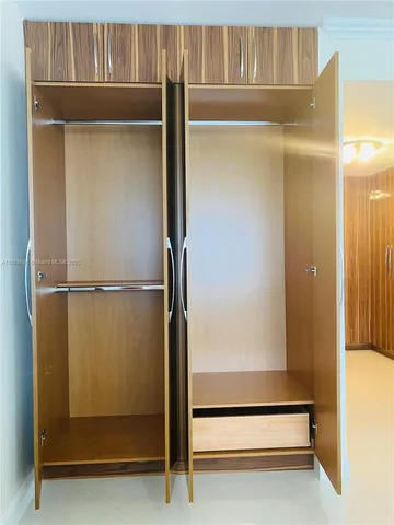 a bathroom with a glass door shower
