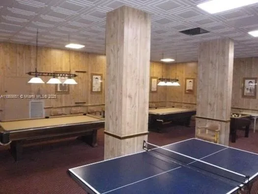 a room with gym equipment and view of living room