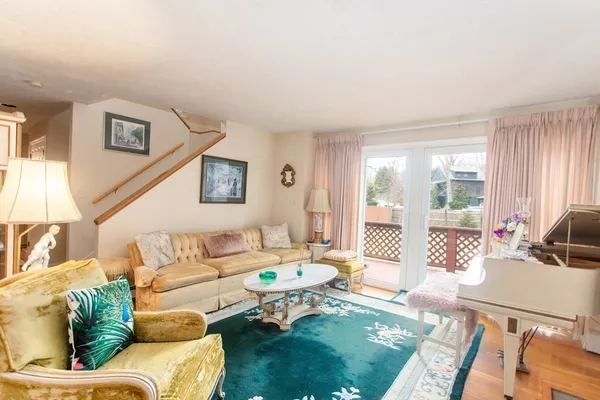 a living room with furniture chandelier and a chandelier